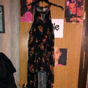 Black flower romper with a skirt in the back